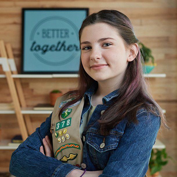 young girl outside smiling